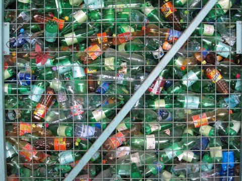 Method reduces plastic bottles to basic components suitable for reuse